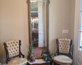 Antique pier mirror with marble base and pair of intricately carved antique chairs 