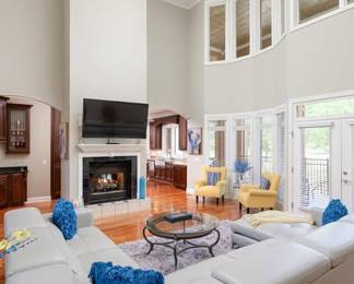 Couch, coffee table, misc. Throw pillows, area rug,  wet bar glasses, and serving items...
