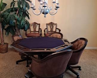 Poker Table with 4 chairs. Converts to solid table if top is flipped.
