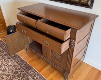 Sunflower motif carved wood chest on casters  