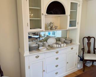 White hutch with brass pulls and shell accent 