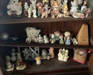 There are several cabinets full of collectible porcelain and ceramic figurines.