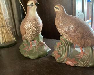 A couple of bird figurines.