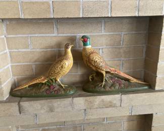 Two ceramic pheasants adorn the fireplace.