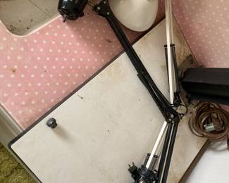 There are two Long neck light fixtures that can be attached to desks.