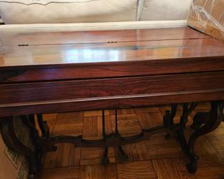 Melodeon in a beautiful case. Antique and quit lovely. The wood is gorgeous! It also doubles as a table! Another sweet piece!