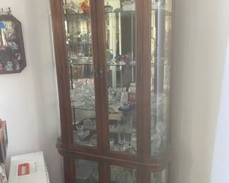 Three curio cabinets and crystal