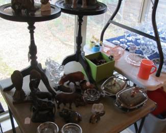 Bombay frame top accent tables w/ a variety of african handmade figurines.
