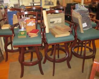 Amazing and very comfortable set of of mahogany finished bar stools with green upholstery. (SOLD IN SETS OF 4 EACH) (2 SETS AVAILABLE, 1 STOOL NOT SHOWN)