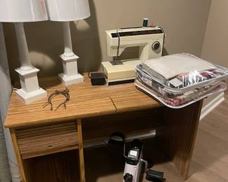 Sewing machine and table, matched set of white lamps, and fabric 