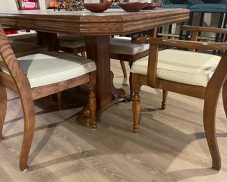 Another view of the dining table with trestle base and dining chairs (arm and side)