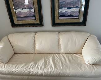 Another view of the leather couch with single seat cushion and attached back cushions