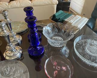 Blue glass and silver-plated candle holders, cut glass and depression glass dishes