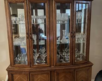 China hutch with glass shelves and lower cabinet - cabinet has lighting to showcase crystal or collections