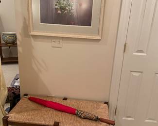 Crate & Barrel rush seated bench, Burberry umbrella, and framed print