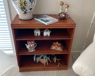 Bookcase shown with Italian pottery, vintage butter dish, and cream/sugar/tea set