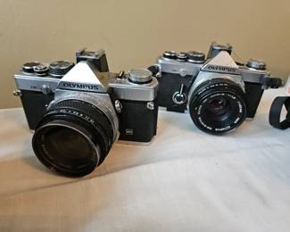 $ 100 Olympus OM 2n, $80 Olympus OM 2