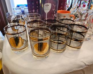$12 (3) MCM Georges Briard Roman Coin Barware,  $12       (4)MCM Georges Briard Black gold stripe Barware, very slight wear on a couple