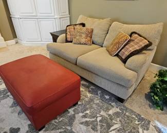$70 Red storage hassock. SOLD- Quality deep loveseat,