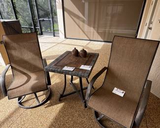 2 Swivel chairs and a tile top table
