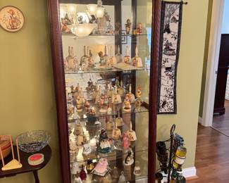 Curio cabinet with sliding front door and key