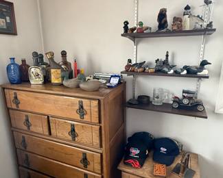 Collectables including carved waterfowl decoys and vintage liquor bottles.  Vintage solid wood dresser and nightstand to set that includes 2 twin beds with headboard, footboard and side rails. 
