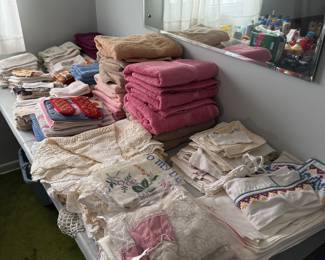 Vintage embroidered linens and nice towels, some new with tags. 