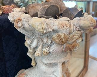 "Shelly" Bust holding a ton of seashells