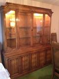 Very large china cabinet, lighted with drawers on the bottom.