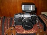 Olympis SLR with lenses and bag