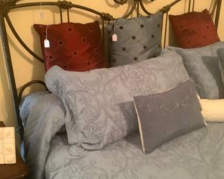 The throw pillows on the bed.