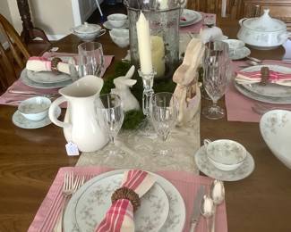 The table setting on dining room table.