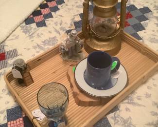 Tray on bed with lantern.