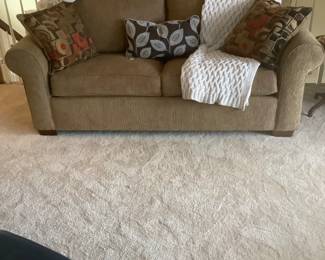 The brown fabric sleeper sofa up stairs.  Excellent condition.