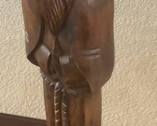 A statue carved out of wood.