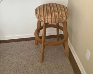 One of the two bar stools that match the fabric on the dining chairs.