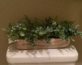 Greenery in wooden bowl.