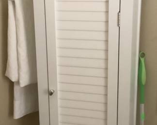 Cabinet in laundry room.