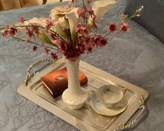 The tray on the bed.