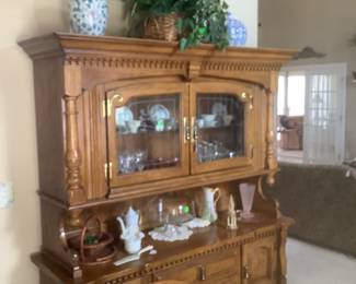 The beautiful China cabinet with glass doors, lots of drawers and shelves.