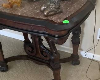 Showing the wood and the carving on the antique table.