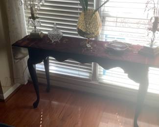 The sofa table. 