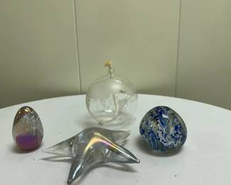Misc. Paperweights | Miscellaneous paperweights including: Starfish-shaped glass paperweight
Egg-shaped glass paperweight
Abstract-shaped glass paperweight
Round world map etched globe. - h. 4 x w. 4.5 in (tallest/widest)
