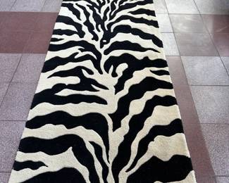 Zebra Runner Rug | Zebra-patterned runner rug.
