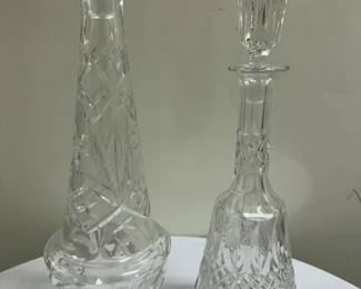 (2pc) Crystal Decanters | Vintage cut crystal decanters with crystal stoppers.  Taller decanter: h. 18.5 in. Shorter decanter: h. 13.5 in.
