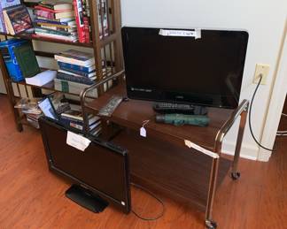 two flat screen t.v's / remote and many books in various rooms plus 2 book shelves - this one folds