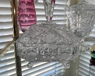 Cut glass covered items and pink glass vases