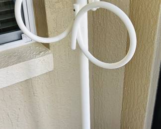 No, it's not art.  Towel rack.