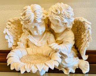 Angel kids eating a sunflower?  Now, I'm sure it's the bourbon.  