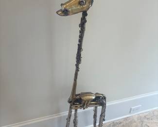 Original giraffe created out of musical instruments